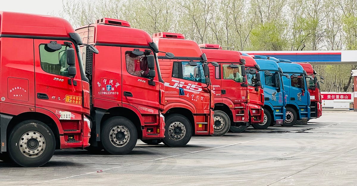 A row of vibrant trucks parked at a transportation depot in Tianjin, China.
